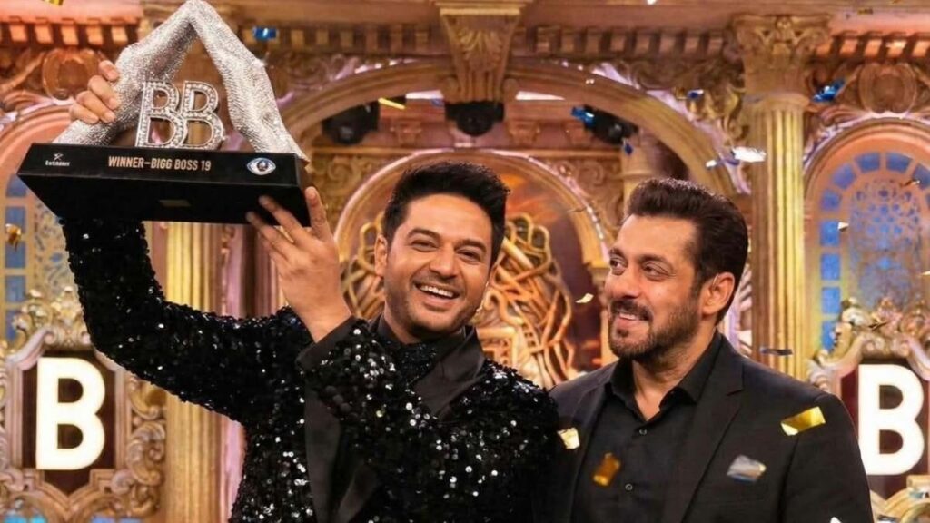 Two men celebrating with a trophy on the set of Bigg Boss 13, vibrant background, entertainment even.