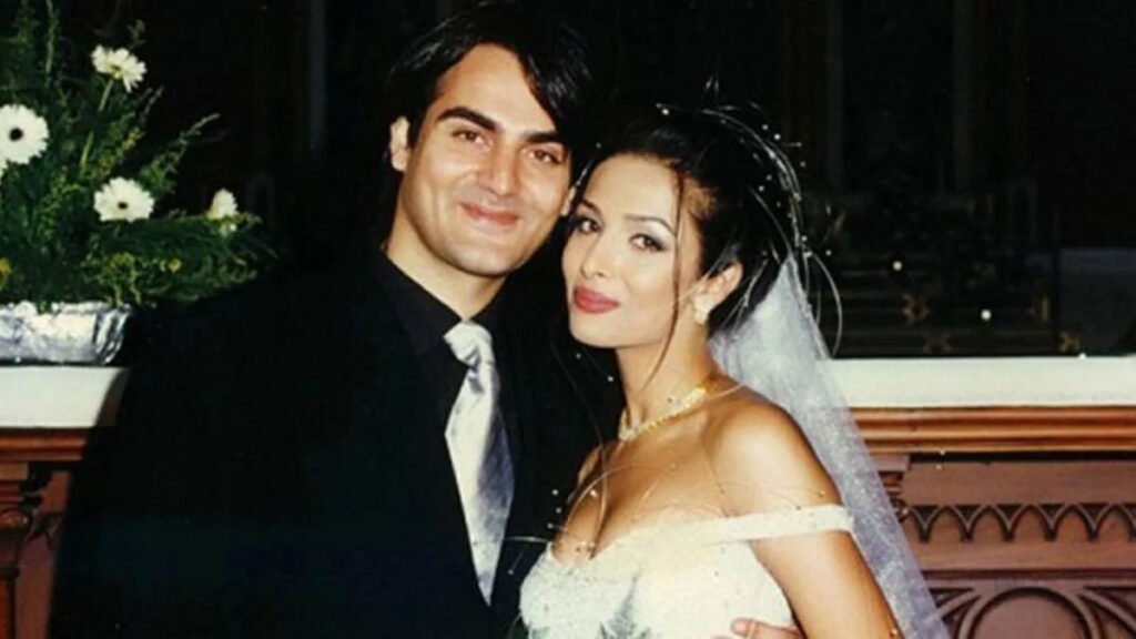 Elegant couple dressed for wedding celebration at Soochna Tantra event, showcasing love and traditio.