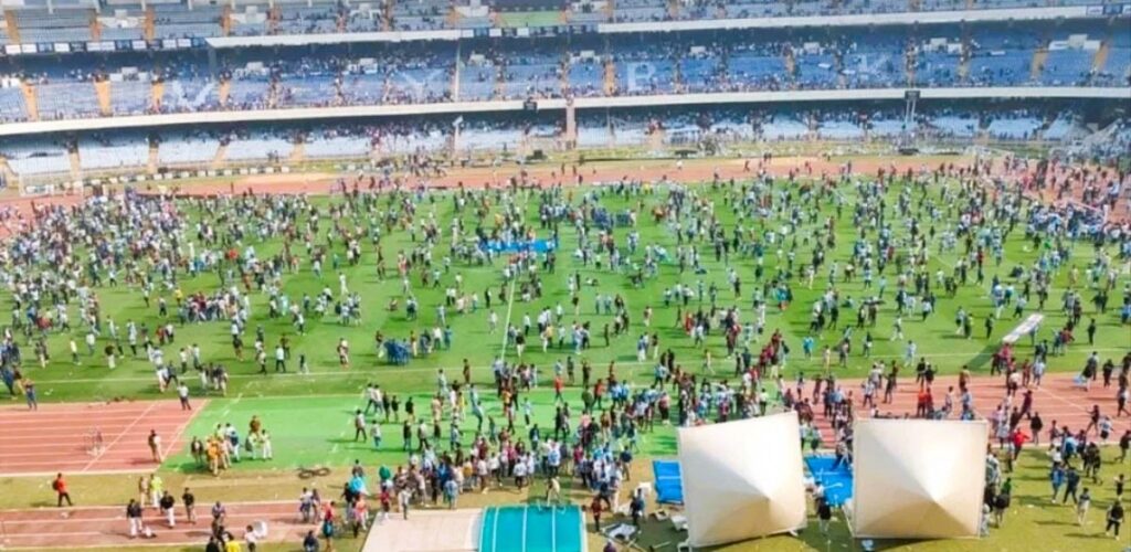 Crowd gathering at a sports stadium during a large event or celebration.