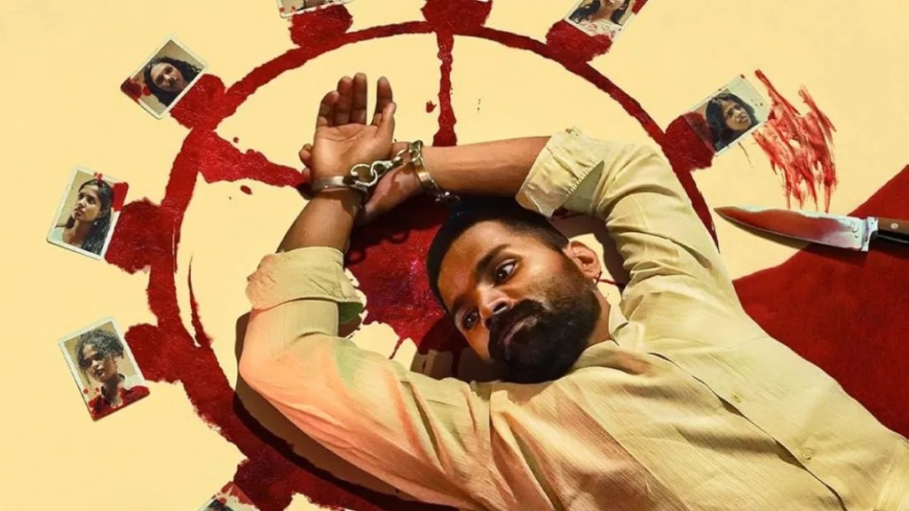 A man lying on the floor with his hands tied, surrounded by photographs and a bloodstain resembling.