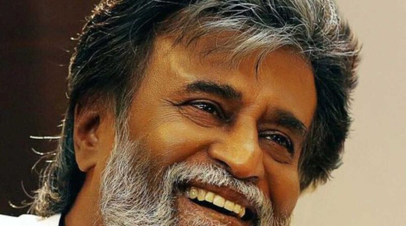 Smiling mature man with gray hair and beard, expressing happiness and warmth.