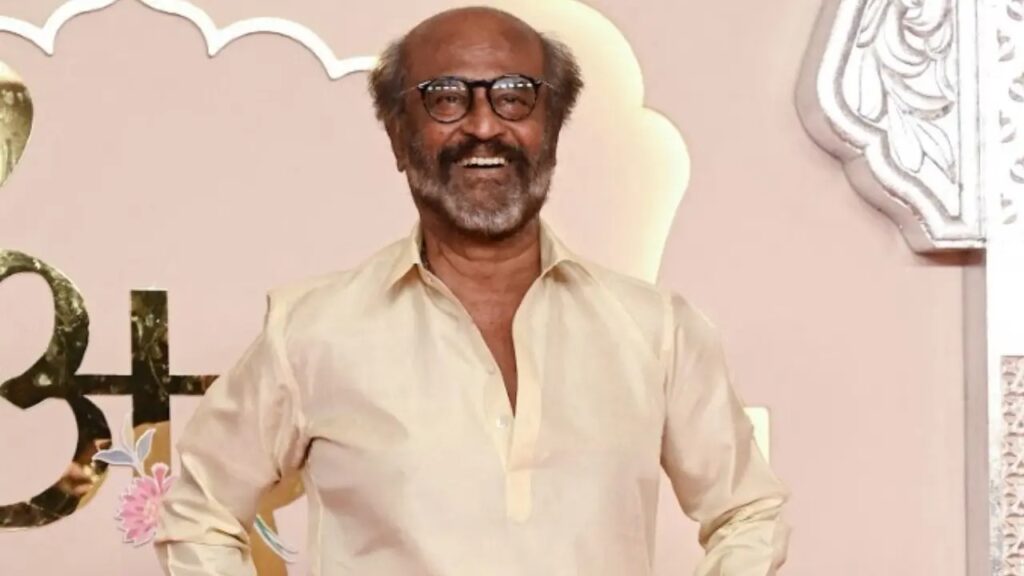 A man with glasses and a beard smiling at an event celebrating SOOCHNA TANTRA.
