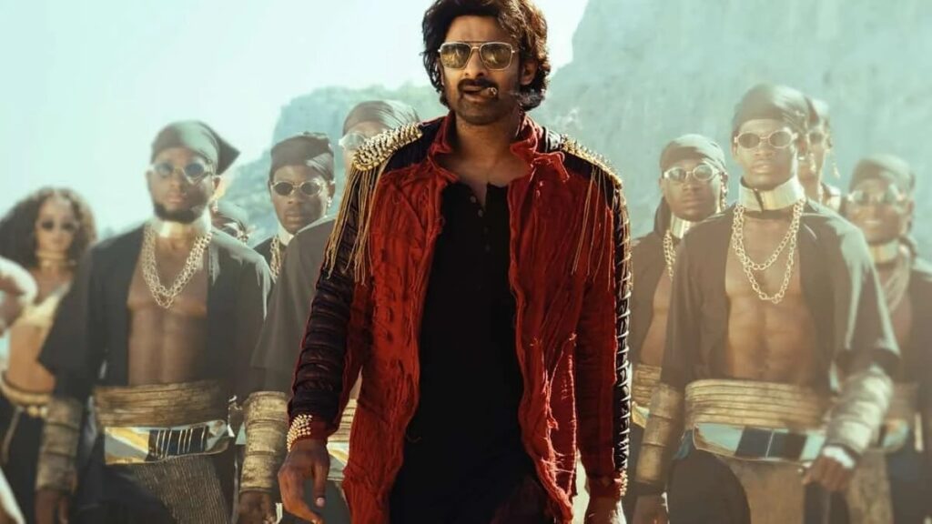 Vibrant man leading a group of stylish men in traditional and modern attire outdoors.