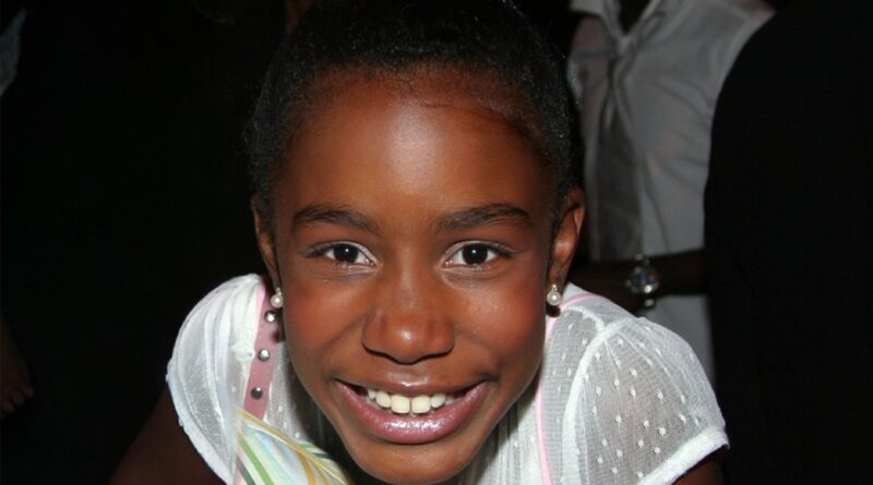 Happy young girl smiling, showcasing joy and positivity at SOOCHNA TANTRA event.