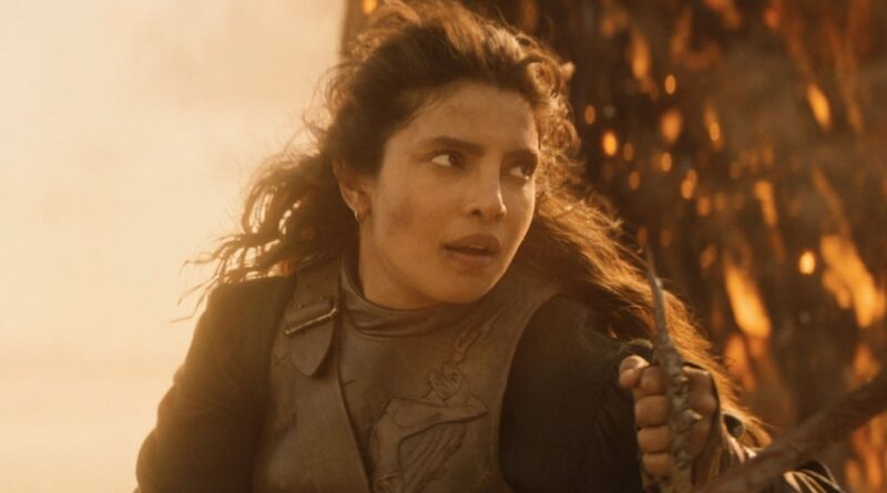 Empowered woman holding a sword with a fiery background symbolizing strength and resilience.